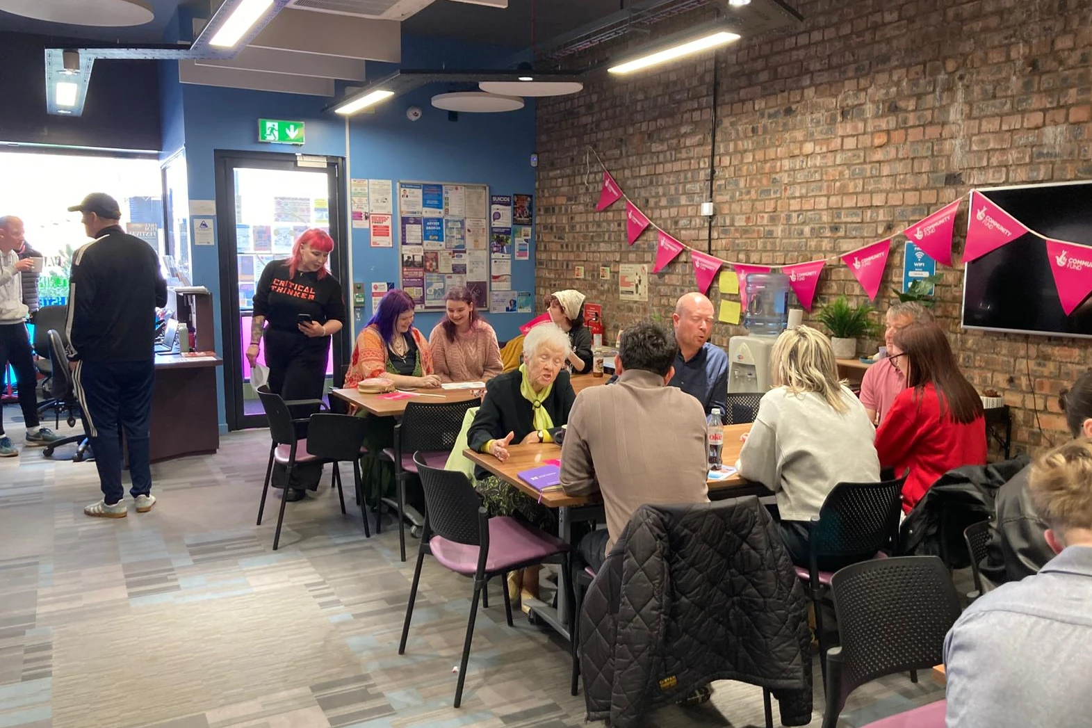 People talking at the community hub in Lochee