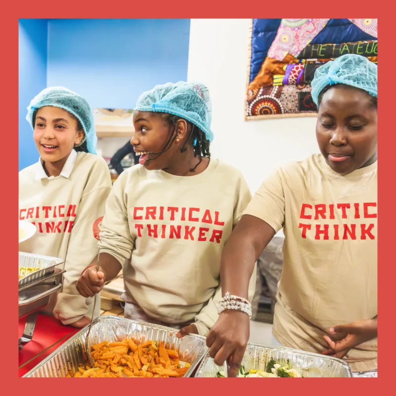Young people serving food together during a Rekindle food education project